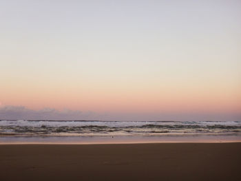 Scenic view of beach against sky during sunset