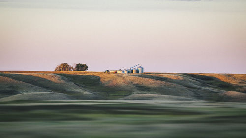 Scenic view of land against clear sky