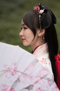 Side view of young woman looking away