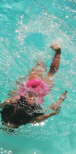 Man swimming in pool