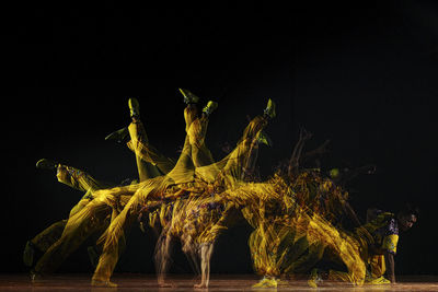 Low angle view of fireworks against black background