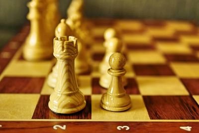 Close-up of chess pieces on table