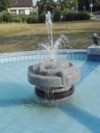 Water fountain in swimming pool at park