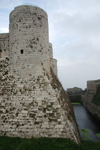 Old ruin building against cloudy sky
