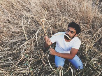 Portrait of man standing in sunglasses