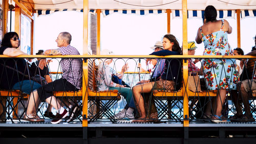 Group of people sitting on chair