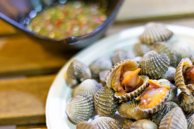 High angle view of clams in plate on table