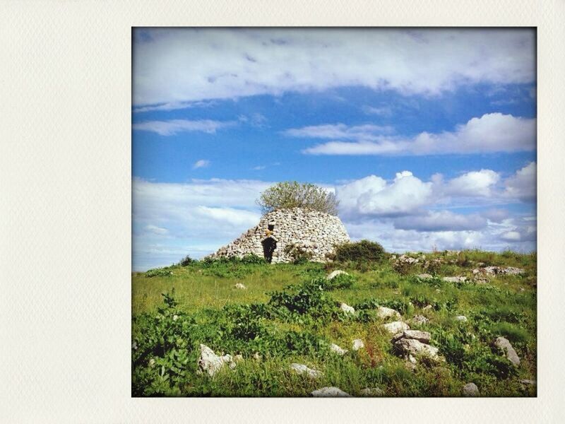 sky, tranquility, landscape, tranquil scene, cloud - sky, nature, grass, scenics, beauty in nature, field, cloud, rock - object, plant, non-urban scene, day, growth, rock formation, no people, transfer print, hill