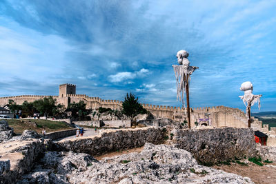 View of old building against cloudy sky
