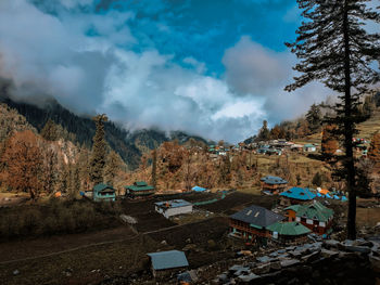 Panoramic view of trees and mountains against sky