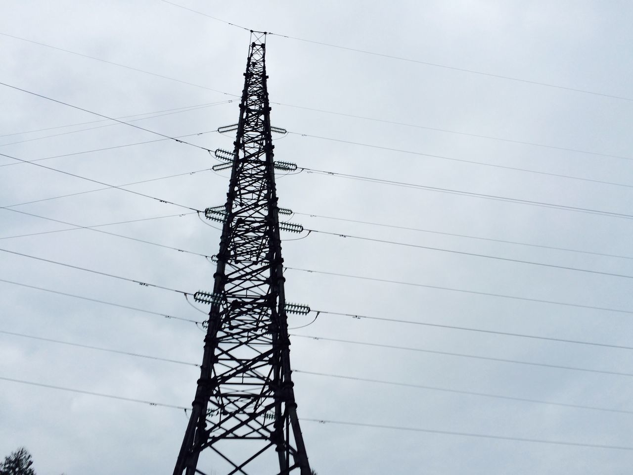 power line, low angle view, electricity pylon, power supply, electricity, connection, cable, technology, fuel and power generation, sky, power cable, silhouette, complexity, tall - high, outdoors, day, no people, built structure, cloud - sky, dusk