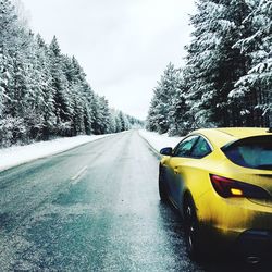 Yellow car on road