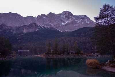 Scenic view of lake and mountains against sky