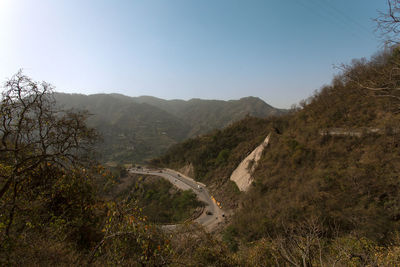 High angle view of road amidst landscape against clear sky