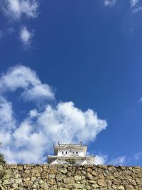 Low angle view of himeji castle against blue sky