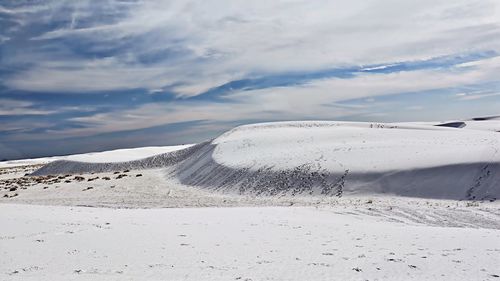 Scenic view of landscape against sky during winter