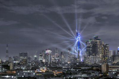 High angle view of city lit up at night