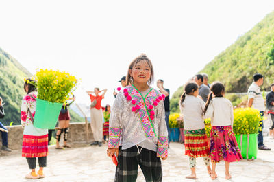 A ethnic minority child in ha giang, vietnam, playing in the sun.