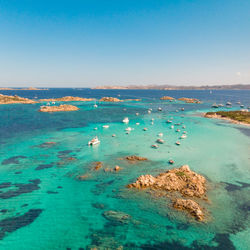 Scenic view of sea against clear blue sky