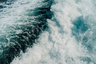 High angle view of wave splashing on sea