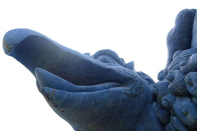 Low angle view of angel statue against clear sky