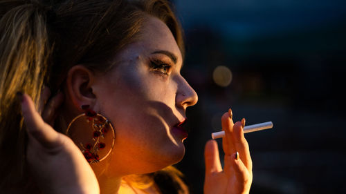 Young woman smoking a cigarette 