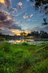 Scenic view of lake against sky during sunset