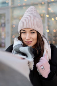 Portrait of smiling woman in snow