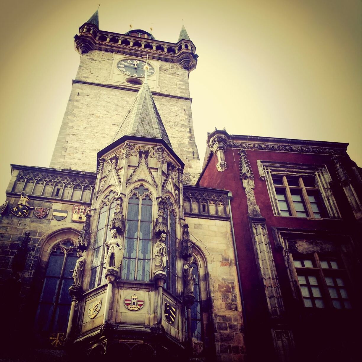 architecture, building exterior, built structure, low angle view, religion, church, place of worship, spirituality, sky, clock tower, tower, travel destinations, history, clear sky, cathedral, city, famous place, clock