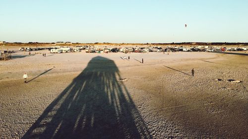 High angle view of people on land against clear sky