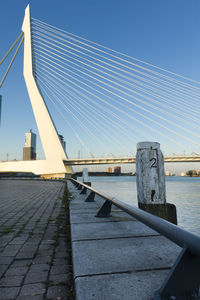 Bridge over river against blue sky