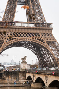 The pont d'iena over the seine river and the eiffel tower in autumn in the rain in paris - france