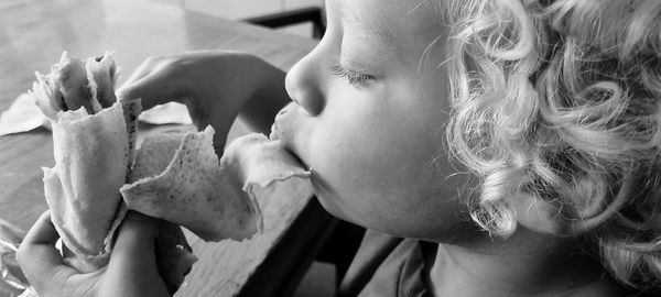 Close-up portrait of woman eating food
