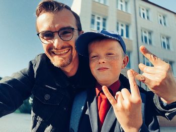 Portrait of smiling man with father