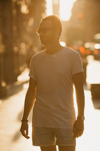 Rear view of man standing in city