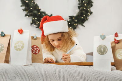 Portrait of girl playing with toy on table