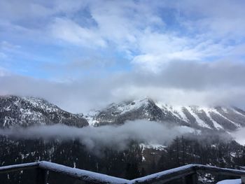 Snow covered mountains against sky