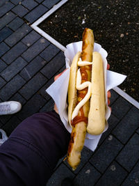 High angle view of hot dog on footpath