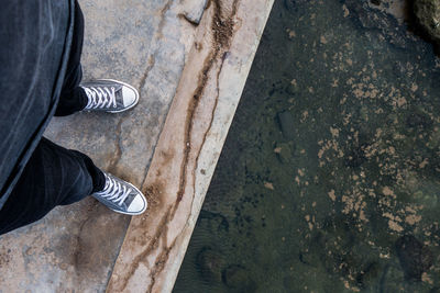 Low section of man standing on floor