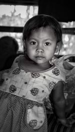 Portrait of girl standing at home