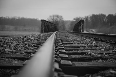 Surface level of railroad track against sky