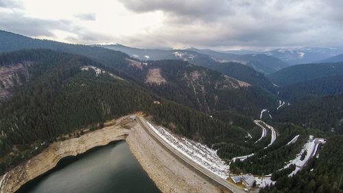 Panoramic shot of road amidst landscape against sky