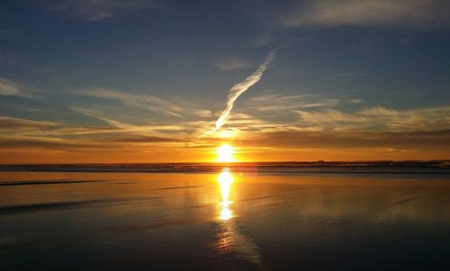 Scenic view of sea at sunset