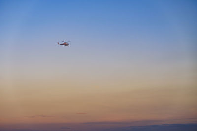 Low angle view of airplane flying in sky