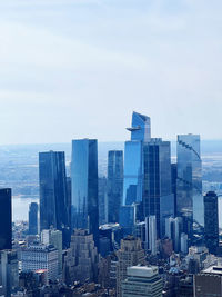 Skyscrapers in city against sky