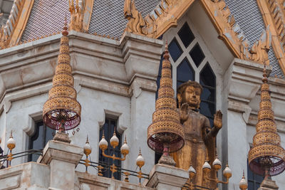 Low angle view of statue against building