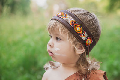 Close-up of young woman wearing hat