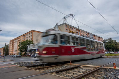 Train on railroad track against sky