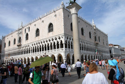 Group of people in front of historical building