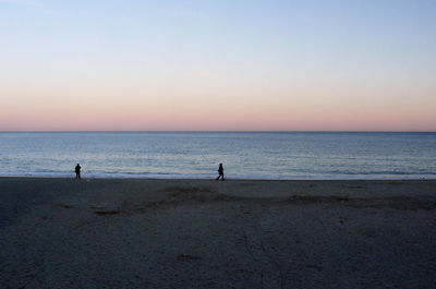 Scenic view of beach against clear sky